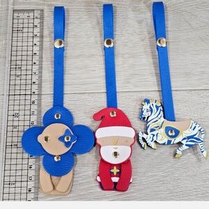 Authentic Louis Vuitton 2024 Carousel Vivienne Purse Charm Set